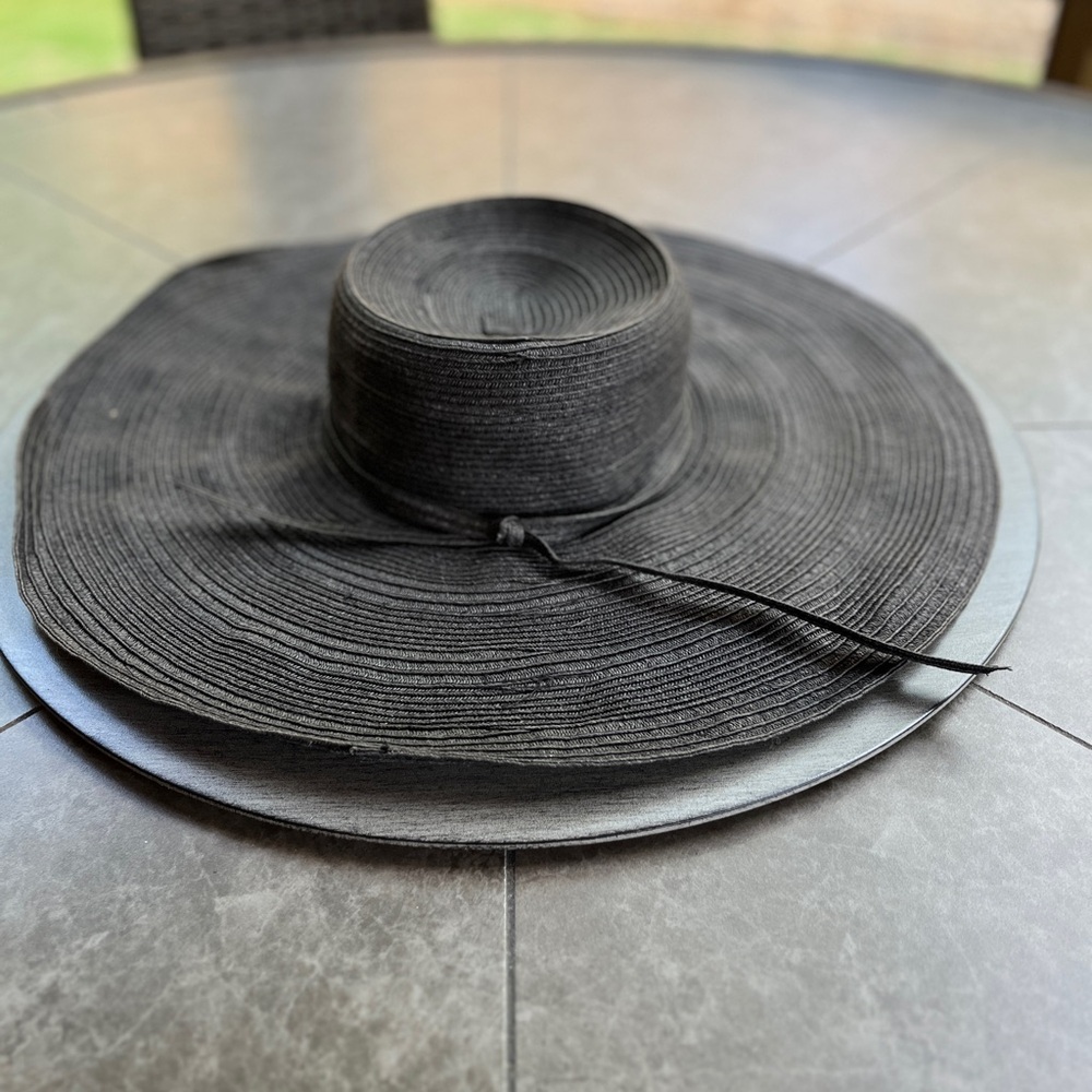 Chic Black Wide-Brimmed Hat with Spiral Design